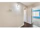 Inviting hallway with neutral walls, modern lighting, and doors leading to other rooms at 8818 W Virginia Ave, Phoenix, AZ 85037