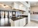 Kitchen area featuring a breakfast bar with granite countertops and stainless steel sink at 8818 W Virginia Ave, Phoenix, AZ 85037