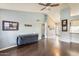 Bright living room featuring vaulted ceilings, ceiling fan, and hardwood flooring at 8818 W Virginia Ave, Phoenix, AZ 85037