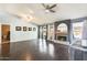 Spacious living room with hardwood floors, recessed lighting, and fireplace at 8818 W Virginia Ave, Phoenix, AZ 85037