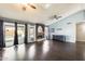 Spacious living room featuring vaulted ceilings, wood floors, and a cozy fireplace at 8818 W Virginia Ave, Phoenix, AZ 85037