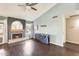 Comfortable living room with fireplace, vaulted ceilings, and hardwood flooring at 8818 W Virginia Ave, Phoenix, AZ 85037