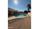 Inviting kidney-shaped pool with rock landscaping at 8862 E Sheena Dr, Scottsdale, AZ 85260