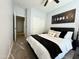 Serene bedroom with carpet, featuring a comfortable bed with decorative pillows and modern decor at 9024 W Alda Way, Peoria, AZ 85382