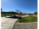 Community playground with picnic tables and play equipment set in a grassy park-like setting at 9024 W Alda Way, Peoria, AZ 85382