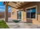 Covered patio with sliding glass door access to the home at 909 W Elm Ave, Coolidge, AZ 85128