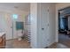 Bathroom with shower, toilet, and linen closet at 909 W Elm Ave, Coolidge, AZ 85128