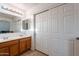 Bathroom with double vanity and storage at 909 W Elm Ave, Coolidge, AZ 85128