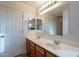 Bathroom with double sinks and lighted mirror at 909 W Elm Ave, Coolidge, AZ 85128