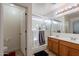 Double vanity bathroom with a large shower at 909 W Elm Ave, Coolidge, AZ 85128