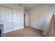 Bedroom with double door closet and carpet flooring at 909 W Elm Ave, Coolidge, AZ 85128