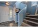 Entryway with stairs, light blue walls, and wood floors at 909 W Elm Ave, Coolidge, AZ 85128