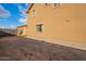 Tan two story house exterior with backyard at 909 W Elm Ave, Coolidge, AZ 85128