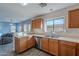 Kitchen features wood cabinets, double sink, and stainless steel dishwasher at 909 W Elm Ave, Coolidge, AZ 85128