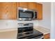 Stainless steel microwave and stove top in the kitchen at 909 W Elm Ave, Coolidge, AZ 85128