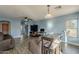 Living room with gray sofas, wood floors, and a bar table at 909 W Elm Ave, Coolidge, AZ 85128