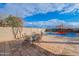 Patio furniture and view of basketball court and pool at 909 W Elm Ave, Coolidge, AZ 85128