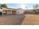 Large backyard with gravel landscaping and a covered patio at 956 W Hudson Way, Gilbert, AZ 85233