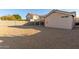 Spacious backyard with gravel and a covered patio area at 956 W Hudson Way, Gilbert, AZ 85233