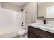 Modern bathroom with dark vanity and white bathtub at 956 W Hudson Way, Gilbert, AZ 85233