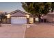 Single-story home with a white garage door and landscaped yard at 956 W Hudson Way, Gilbert, AZ 85233