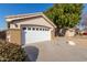 Single story home with a white garage door and drought-tolerant landscaping at 956 W Hudson Way, Gilbert, AZ 85233