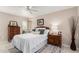 Cozy bedroom with wooden dresser and ceiling fan at 9601 W Greenhurst Dr, Sun City, AZ 85351