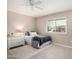 Guest bedroom with ceiling fan and window blinds at 9601 W Greenhurst Dr, Sun City, AZ 85351