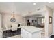 Kitchen island with granite countertop, open to dining area and living room at 9601 W Greenhurst Dr, Sun City, AZ 85351