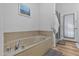 Relaxing bathroom with a large soaking tub and separate shower at 1040 N 113Th Pl, Mesa, AZ 85207
