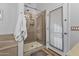 Clean bathroom with a walk-in shower and exterior access at 1040 N 113Th Pl, Mesa, AZ 85207