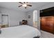 Primary bedroom with ensuite bathroom and home office area at 1040 N 113Th Pl, Mesa, AZ 85207