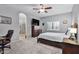 Spacious Primary bedroom with large TV and ensuite bathroom at 1040 N 113Th Pl, Mesa, AZ 85207