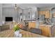 Kitchen dining area with a wood table and wicker chairs at 1040 N 113Th Pl, Mesa, AZ 85207