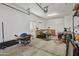 Spacious garage with ample storage shelving and room for multiple vehicles at 1040 N 113Th Pl, Mesa, AZ 85207