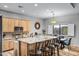 Eat-in kitchen with granite countertops and light wood cabinets at 1040 N 113Th Pl, Mesa, AZ 85207