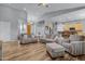 Open concept living room with hardwood floors and kitchen access at 1040 N 113Th Pl, Mesa, AZ 85207