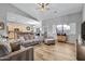 Open living space featuring hardwood floors and a view of the kitchen at 1040 N 113Th Pl, Mesa, AZ 85207