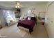 Spacious bedroom with plush bedding and window at 10602 W Deanne Dr, Sun City, AZ 85351