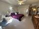 Bright bedroom with a queen-size bed and dresser at 10602 W Deanne Dr, Sun City, AZ 85351