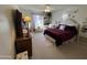 Charming bedroom with plush bedding and built-ins at 10602 W Deanne Dr, Sun City, AZ 85351