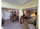 Open dining area with wood table and chairs, offering a view to living room at 10602 W Deanne Dr, Sun City, AZ 85351