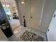 Clean entryway with tile floors and storage at 10602 W Deanne Dr, Sun City, AZ 85351