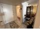 Front entry with tiled floors and a view into the living room at 10602 W Deanne Dr, Sun City, AZ 85351