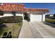 White single story home with tile roof, attached garage, and walkway at 10602 W Deanne Dr, Sun City, AZ 85351