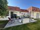 Back exterior view showing patio and landscaping at 10602 W Deanne Dr, Sun City, AZ 85351