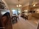Eat-in kitchen with light wood cabinets, and a view into the adjacent dining area at 10602 W Deanne Dr, Sun City, AZ 85351