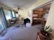 Kitchen features breakfast bar and access to sunroom at 10602 W Deanne Dr, Sun City, AZ 85351