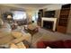 Living room with fireplace and comfy seating area at 10602 W Deanne Dr, Sun City, AZ 85351