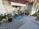 Small patio with seating area, plants, and awning at 10602 W Deanne Dr, Sun City, AZ 85351